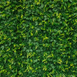 Vibrant green flower wall with dense foliage and small yellow flowers.